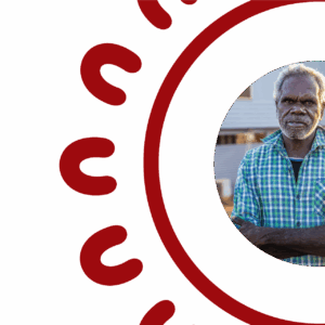 Circular portrait of an Aboriginal Elder with short grey hair and a white beard, arms crossed, wearing a green and white checked shirt, framed by the SCS Indigenous decorative red circular border featuring repeating U-shaped symbols inspired by Aboriginal art motifs, on a white background.